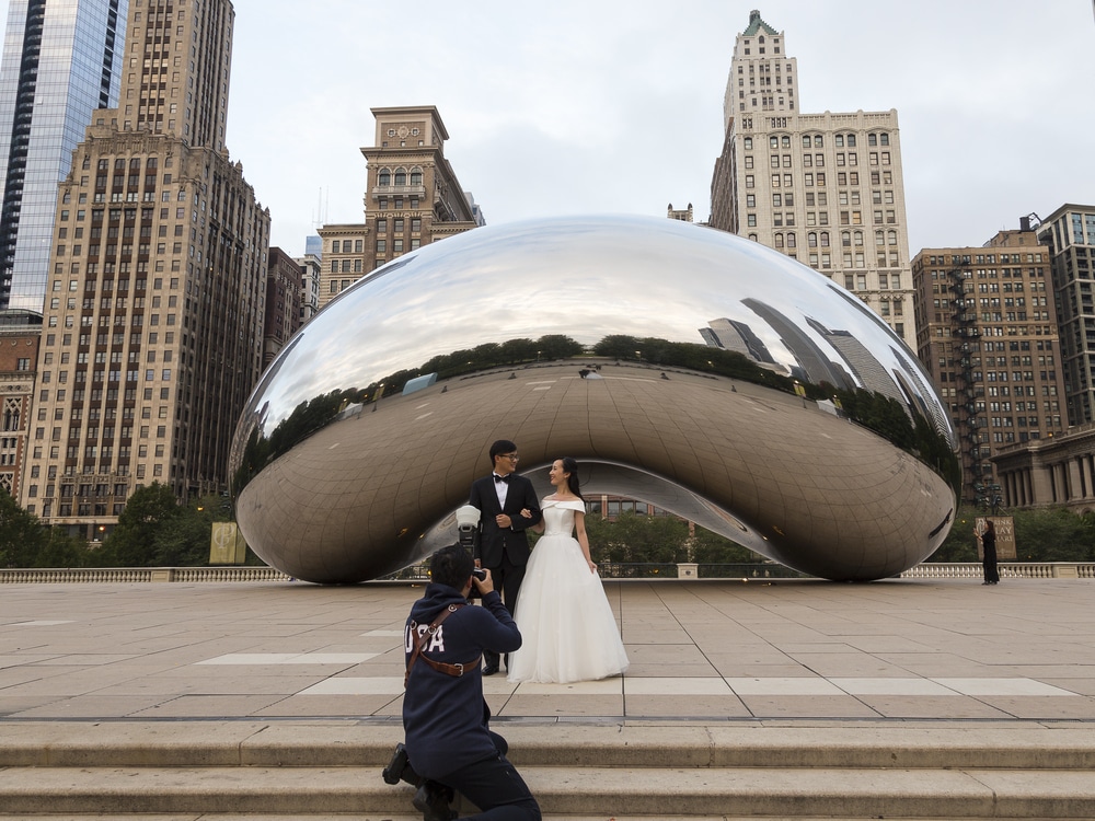 Asian,Wedding,Couple,Being,Photographed,In,Front,Of,The,Cloud